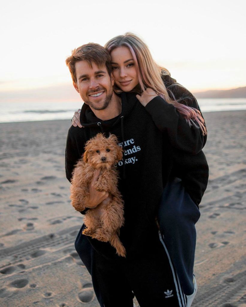 Charly Jordan's boyfriend Robert carrying her and a dog