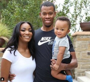 Rodney Hood with his wife and son