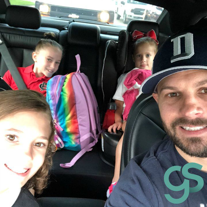 Gabriel Swaggart clicking selfie sitting inside his car with his daughters
